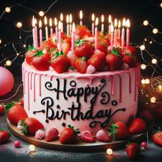 a birthday cake with strawberries and candles