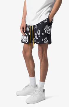 Stay comfy all day long in these lounge-ready knit shorts punctuated by a contrast drawstring and handy side pockets. 5 1/2" inseam; 12" leg opening; 12 1/2" front rise Elastic/drawstring waist Side-seam pockets 100% acrylic Machine wash, dry flat Imported Black Shorts With Functional Drawstring For Streetwear, Casual Streetwear Shorts With Functional Drawstring, Black Relaxed Fit Shorts For Loungewear, Casual Black Shorts For Loungewear, Black Lounge Shorts With Side Pockets, Black Bottoms For Summer Lounging, Black Bottoms For Lounging In Summer, Black Summer Bottoms For Lounging, Contemporary Accessories