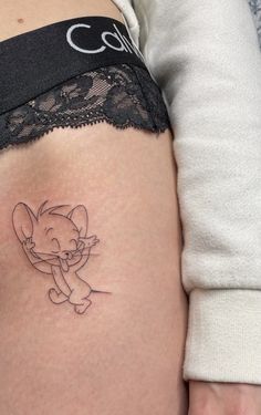 a woman's thigh with an elephant tattoo on it