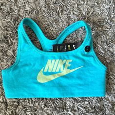 Brand New With Tags Blue Racerback Sports Bra For Light Sports, Blue Sweat-resistant Sports Bra For Gym, Blue Racerback Sports Bra, Blue Moisture-wicking Tops For Playwear, Blue Athleisure Activewear For Playwear, Blue Nike Sports Bra For Training, Nike Blue Sports Bra For Training, Nike Blue Sports Bra With Moisture-wicking, Nike Sporty Blue Sports Bra