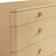 a close up of a wooden dresser with knobs on the top and bottom drawers