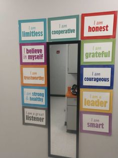 an office door decorated with multicolored magnets that say i am sorry, i am