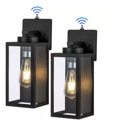 two black outdoor lights with wifi signals