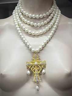 Four strands white pearl necklace with Baroque style cross. The cross has pearl cabochon centre. Make a statement wearing this unique piece. 4 strands of 12mm glass pearls. The fourth strand has its own livestream claw clasp, so that you can wear the cross on its own! Materials used are: 12mm crystal glass pearls or regular glass pearls with perlized coating. Cross is zinc alloy with glass rhinestones.  Ask me any questions prior to order i am happy to reply. Luxury Baroque Necklace With High Luster, Exquisite Luxury Baroque Jewelry, Statement Cross Necklace, Elegant Pearl Necklace With Cross Pendant, White Cross Jewelry For Party, White Cross Necklace For Party, White Cross Pearl Pendant Necklace, White Pearl Cross Necklace With Pearl Charm, White Pearl Cross Necklace