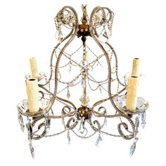 a fancy chandelier with candles and crystal beads on it's sides, isolated against a white background