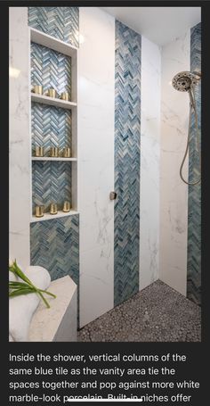 a bathroom with blue and white tiles on the walls, shelves in the shower area