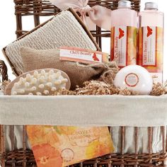 a wicker basket filled with lots of different types of soaps and lotions