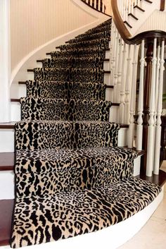 a set of stairs with leopard print carpet