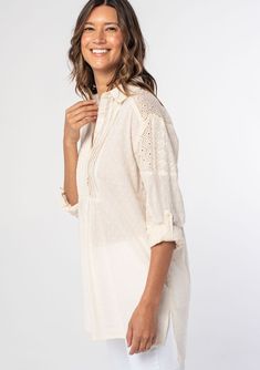 A relaxed-fit cotton tunic shirt in a textured embroidery patchwork and dobby mix. Patchwork embroidery and dobby Tunic shirt Relaxed fit Long rolled sleeve with button tab closure Long tunic length High/low hemline Side vents Collared neckline Button front Pintuck details Sheer Cotton Summer shirt A textured patchwork embroidery and dobby mix add interest to this cotton bohemian shirt. Featuring delicate pintuck details at the front yoke and long rolled sleeves with a button tab closure. An eff Textured Embroidery, Bohemian Shirt, Patchwork Embroidery, Embroidery Patchwork, Cotton Tunic, Embroidered Tunic, Women Tunic Tops, Long Tunic, Tunic Shirt