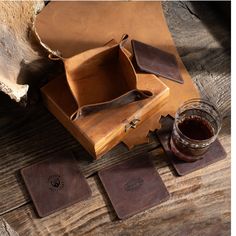 Set of 4 Leather Coasters with Holder--a fusion of style and practicality designed to elevate your home bar experience. Crafted with meticulous attention to detail, these Personalized Leather Coasters are more than just drink accessories; they are a sophisticated addition to your living space. Each coaster in this set is crafted from high-quality leather, ensuring durability and a touch of elegance. The Engraved Square Leather Coasters add a personalized touch that goes beyond conventional coaster sets. Choose a monogram, initials, or a special message to be skillfully engraved on each coaster, making them a unique and thoughtful addition to your home decor. The coordinating Holder not only keeps your coasters neatly organized but also adds a stylish element to your home bar setup. Crafted Leather Coaster Ideas, Coaster Leather, Coaster With Holder, Drink Accessories, Home Bar Setup, Leather Coaster Set, Bar Setup, Bar Scene, Coaster Sets