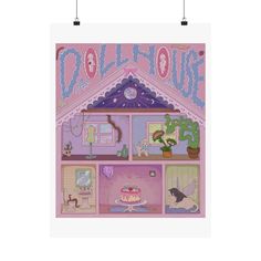 a pink dollhouse with lots of furniture and decorations on the front, hanging from hooks