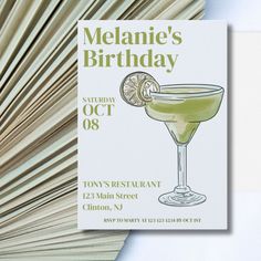 a flyer for a birthday party with a cocktail in the middle and an open book behind it