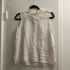 Very Cute White Linen Top From Zara, Size Xs High Neck With Very Nice Embroidery Around The Neckline, Front & Back. Never Worn! Zara Sleeveless Top With Floral Embroidery, Zara Sleeveless Tops With Floral Embroidery, Elegant Sleeveless Tops With Crochet Trim, Chic Sleeveless Embroidered Cotton Top, Elegant Summer Tops With Crochet Trim, Zara Sleeveless Crochet Top For Spring, Sleeveless Linen Top With Lace Trim, Feminine Sleeveless Linen Tops, Elegant Cotton Crochet Top With Lace Trim