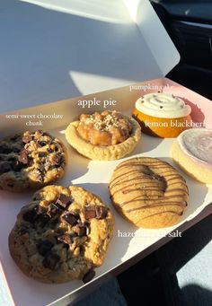 an assortment of cookies and desserts on a tray