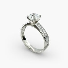 a white gold engagement ring with baguettes and channeled diamonds on the side