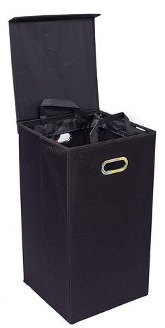 an open black storage box with handles on the bottom, and two bags in it