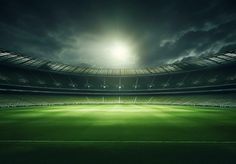 an empty soccer stadium at night with the lights on and dark clouds in the sky