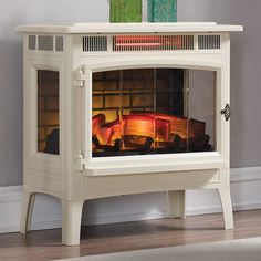 a white fireplace with a fire in it