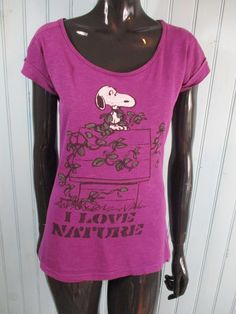 Vintage 'Peanuts' tee-shirt size 12 UK. Purple cap sleeve, snoopy on his house and 'I love nature' written underneath. Dimensions: Bust: 35 Inches. Length: 23 Inches. Made by PEANUTS Size 12 Uk, Peanuts Snoopy, Cap Sleeve, Cap Sleeves, Peanut, Tee Shirt, Snoopy, Tee Shirts, Size 12