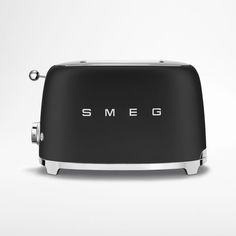 the smeg toaster is black and silver