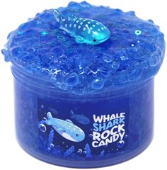 a blue container filled with lots of bubbles and a fish on it's lid