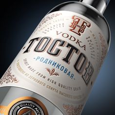 a bottle of vodka on a black background with the word totto written in russian