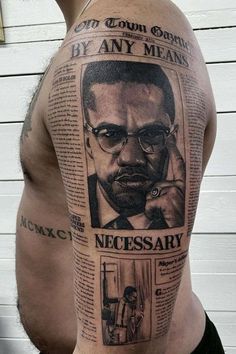 a man with glasses and a newspaper tattoo on his arm