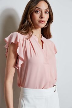 The soft cap sleeves lend a femme twist to this luxe georgette top. With its contour pleat detail neckline, it is perfect for layering with your favorite blazer or wearing on its own. T-Tahari Short Sleeve V-Neck Top Runs true to size. Model is 5'9" and wearing size S Dry Clean Only Imported Style #: THF44013 Fitted Ruffle Sleeve Blouse For Work, Elegant Ruffle Sleeve Tops For Office, Chic Formal Tops With Ruffle Sleeves, Elegant Flutter Sleeve Blouse For Work, Elegant Fitted Tops With Flutter Sleeves, Feminine Fitted Flutter Sleeve Blouse, Chic Ruffle Sleeve Tops For Work, Elegant Ruffle Sleeve Blouse For Work, Spring Workwear Tops With Flutter Sleeves