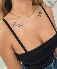 a woman with a small tattoo on her chest