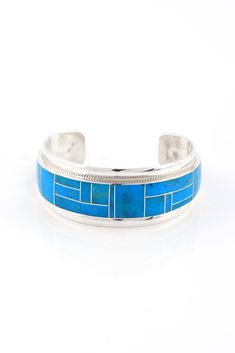 This gorgeous Zuni Kingman Turquoise channel Inlay Cuff was handmade by Glendora Booqua. It has 26 perfect channel inlays of deep blue Turquoise. Every detail of this bracelet shows the high quality of the stones and the silversmithing. The sterling silver is beautifully finished to be sleek and comfortable. The Zuni Indians of New Mexico are known for their ability to hand cut tiny stone pieces and make tiny bezels to hold them. The Zuni's attention to detail and expert craftsmanship makes thei Kingman Turquoise, Blue Turquoise, Turquoise Jewelry, Turquoise Blue, Deep Blue, Cuff Bracelets, Sleek, Cuff, Turquoise