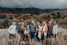 a group of people standing next to each other in a field