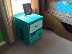 a blue nightstand with a cartoon face on it