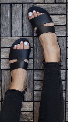 "*PLEASE NOTE: these shoes are narrower that most sandals, if you wear half size please choose one size up* *After order please leave a note of a contact No so we can add it to the carrier's information * One of our best sellers! \"Harmony \" leather slides are so easy to wear,all day every day Made of greek genuine soft leather, have a minimalistic chic design , this slipper is a must have Designed and handcrafted in Greece from the finest genuine leather using traditional methods. Our genuine Black Open Toe Toe Ring Sandals For Beach, Black Single Toe Strap Slippers For Vacation, Black Vacation Slippers With Single Toe Strap, Black Slippers With Single Toe Strap For Beach, Black Flat Heel Toe Ring Sandals For Vacation, Black Slides With Single Toe Strap For Vacation, Black Leather Flat Toe Ring Sandals, Minimalistic Chic, Tie Up Sandals