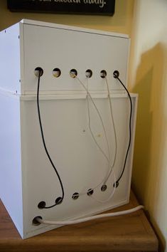 a white refrigerator sitting on top of a wooden counter