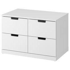 a white cabinet with three drawers and two black handles