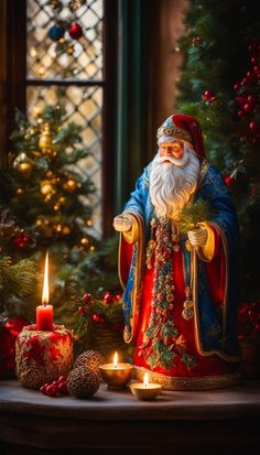 a statue of santa claus next to a lit candle and christmas tree with ornaments around it