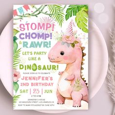 a pink dinosaur birthday party card with flowers and leaves on the front, along with a white plate