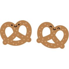 two pretzels with faces drawn on them