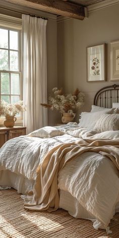 a bed with white sheets and pillows in a bedroom next to a window filled with flowers