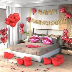 a bedroom decorated in red and pink with hearts floating on the bed, along with balloons that read happy anniversary