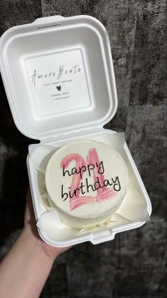 a birthday cake in a white box with writing on it