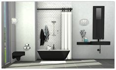 a black and white bathroom with brick walls