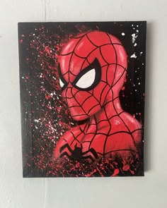 a painting of a spider man on a wall