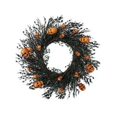 a wreath with pumpkins and pine needles