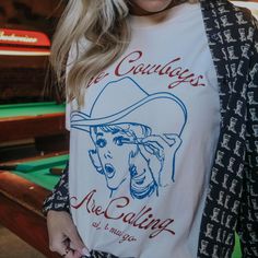 When the cowboys call, we must go! This vintage inspired tee is one we are all loving with the navy blue and rustic red font. Wellness Candles, Retro Blue, Baby Jewelry, Beauty Lover, Comfort Colors Tee, Book Box, Cowboy Hat, White Tee, Western Fashion