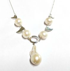 1. Pearl Chain Necklace. 2. 925 silver made 3. Necklace length - 20 inches. 4. Pearl pieces - 5 5. Total weight- 20.580 Grams 6. 100% Handmade. 7. Silver Weight - 4.360 Grams 8. Pearl Weight - 81.1 Carats 9. Closure - S CLASPS This Pearl Necklace is totally handmade from start to finish. We have used 925 silver to make this. This item is irresistible! We hope you add this in your favorites or basket and place an order with us. Thanks. Anirudh Gems Store :- https://www.etsy.com/uk/shop/ANIRUDHGEM White Polished Beads Sterling Silver Necklace, White Polished Bead Sterling Silver Necklace, White Sterling Silver Necklace With Polished Beads, Silver Single Strand Custom Necklace As Gift, Sterling Silver Round Beads Necklace For Anniversary, White Sterling Silver Necklaces With Silver Beads, White Sterling Silver Necklace With Silver Beads, Pearl Jewelry Silver, Pearl Silver Necklace