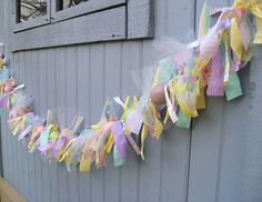 there is a colorful streamer on the side of this house that has been decorated for easter