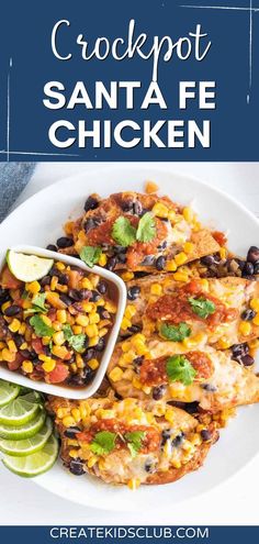 a white plate topped with chicken and black beans next to limes on the side