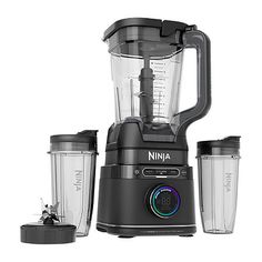 the ninja blender is black and has three cups on it, including one with a lid