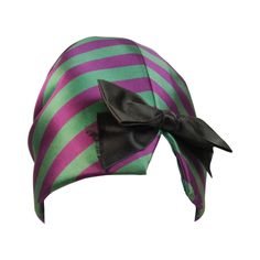 This Yves Saint Laurent Rive Gauche hat is composed of a purple and green striped silk. The hat features a rouched detail and bow. In excellent vintage condition, the black bow has frayed edges as a construction detail (see photos). Made in France. This YSL hat is from an extensive collection I acquired from the estate of a very wealthy lady who chose to live in Paris for several decades and was determined to spend her entire fortune living luxuriously in a hotel and shopping solely at CHANEL an Hat Silk, Hat Shelf, Saint Laurent Boots, 1940s Hats, Bows For Sale, Tall Hat, Spool Crafts, Purple Hat, Striped Hat